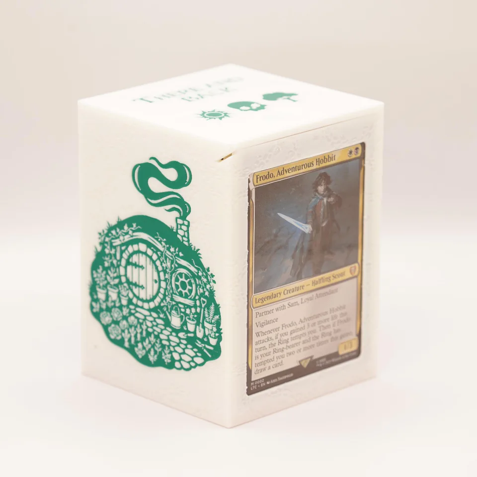 The Hobbit Shire deck box in cream and green, with a round-door design and a front commander window